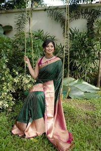 Emerald Green Banarasi Soft Silk Saree with Gold Zari Buttis and Peach Pink Woven Border  in Surat