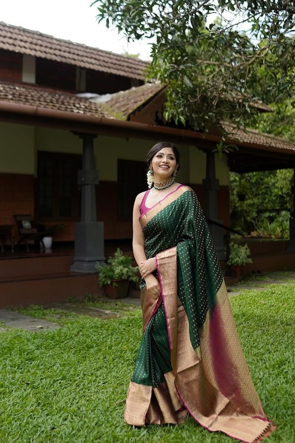 Emerald Green Banarasi Soft Silk Saree with Gold Zari Buttis and Peach Pink Woven Border  in Surat