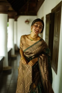 Floral Weave Banarasi Soft Silk Saree with Gold and Copper Zari in Blue, Cream and Green  in Surat