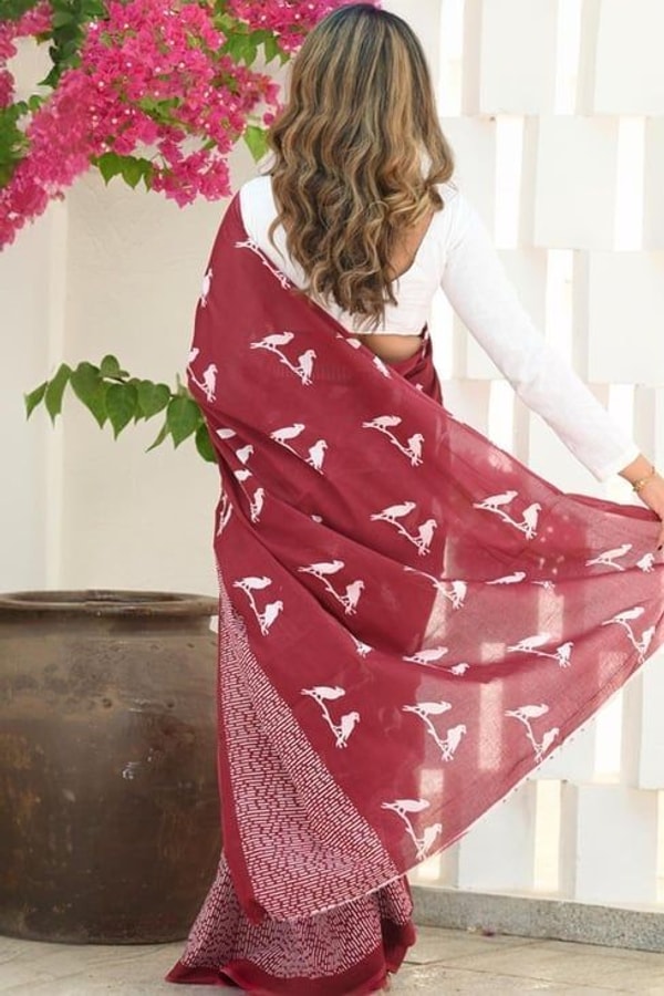 Flying Bird Motif Saree with Striped Pallu in Maroon, Orange and Charcoal Grey  in Surat