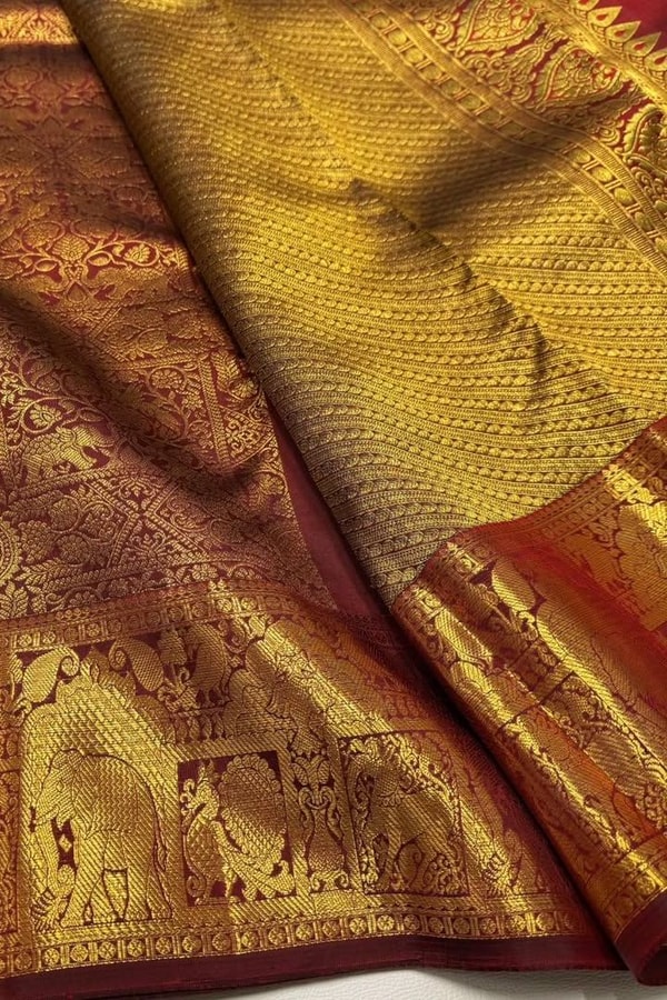 Gold Tissue Look Banarasi Soft Silk Saree with Heavy Zari Weave and Maroon Accents  in Surat