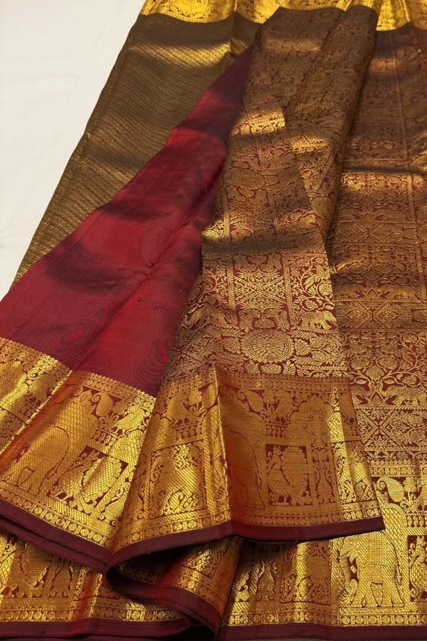 Gold Tissue Look Banarasi Soft Silk Saree with Heavy Zari Weave and Maroon Accents  in Surat