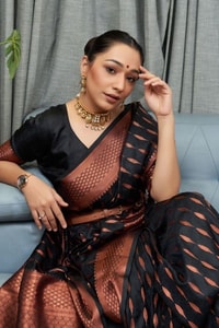Ikat-Inspired Banarasi Soft Silk Saree with Copper Zari Weaving and Tasselled Pallu  in Surat