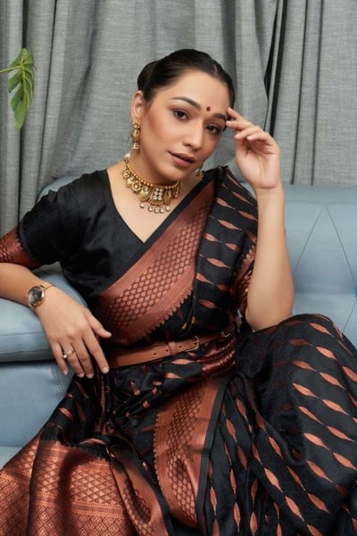 Ikat-Inspired Banarasi Soft Silk Saree with Copper Zari Weaving and Tasselled Pallu in Surat