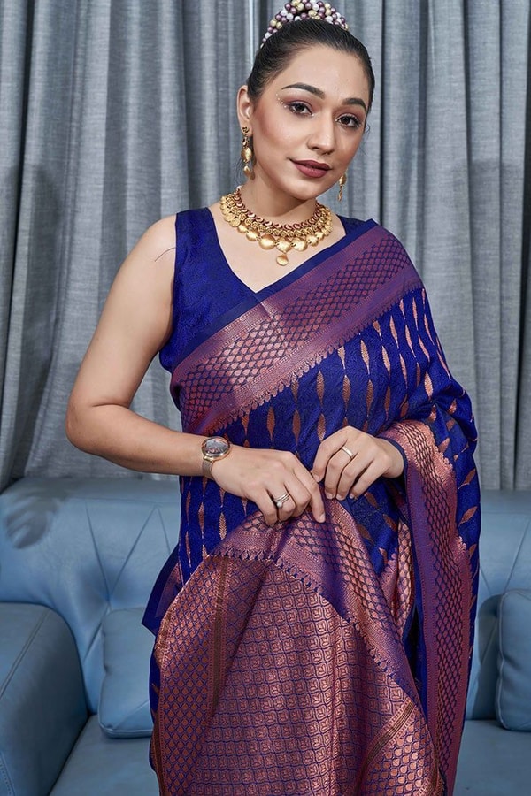 Ikat-Inspired Banarasi Soft Silk Saree with Copper Zari Weaving and Tasselled Pallu  in Surat