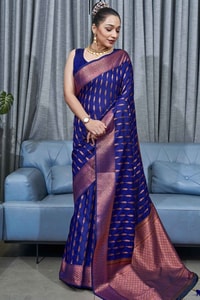 Ikat-Inspired Banarasi Soft Silk Saree with Copper Zari Weaving and Tasselled Pallu  in Surat