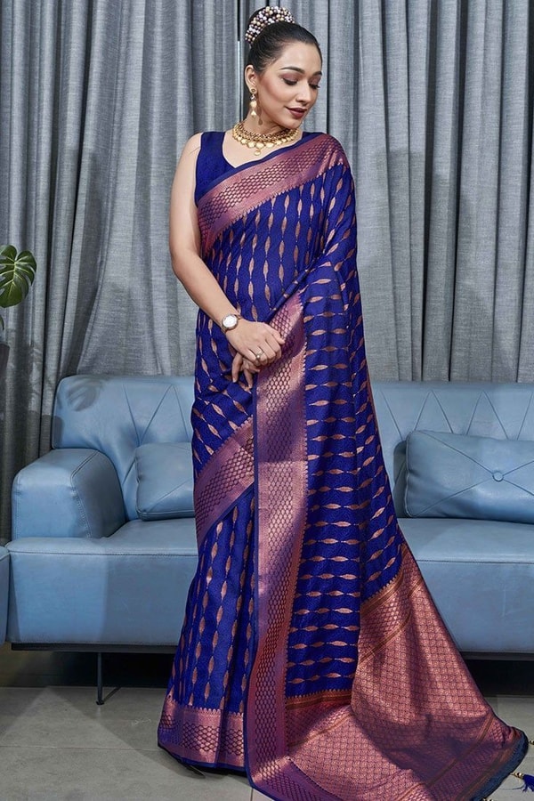 Ikat-Inspired Banarasi Soft Silk Saree with Copper Zari Weaving and Tasselled Pallu  in Surat