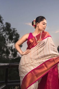 Ivory Pinstripe Banarasi Soft Silk Saree with Contrast Rani Pink Border and Copper Zari  in Surat