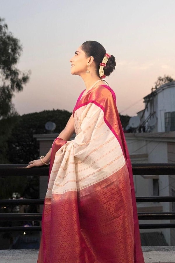 Ivory Pinstripe Banarasi Soft Silk Saree with Contrast Rani Pink Border and Copper Zari  in Surat