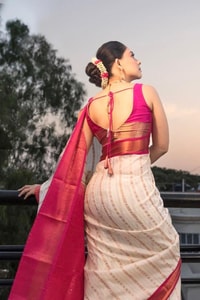 Ivory Pinstripe Banarasi Soft Silk Saree with Contrast Rani Pink Border and Copper Zari  in Surat