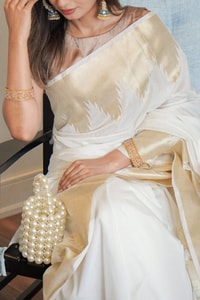 Ivory White Banarasi Soft Silk Saree with Broad Gold Zari Border and Woven Gold Pallu  in Surat