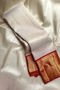 Kanjivaram-Style Cream Banarasi Soft Silk Saree with Wide Gold Zari Border in Green or Red  in Surat