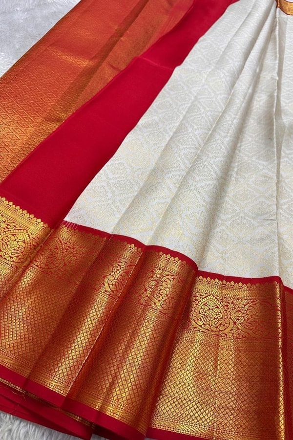 Kanjivaram-Style Cream Banarasi Soft Silk Saree with Wide Gold Zari Border in Green or Red  in Surat