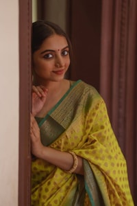 Lemon Yellow Banarasi Soft Silk Saree with Polka Buttis and Contrast Dark Brocade Border  in Surat