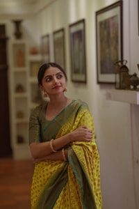 Lemon Yellow Banarasi Soft Silk Saree with Polka Buttis and Contrast Dark Brocade Border  in Surat