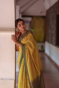 Lemon Yellow Banarasi Soft Silk Saree with Polka Buttis and Contrast Dark Brocade Border  in Surat