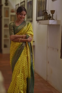 Lemon Yellow Banarasi Soft Silk Saree with Polka Buttis and Contrast Dark Brocade Border  in Surat