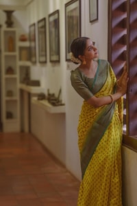 Lemon Yellow Banarasi Soft Silk Saree with Polka Buttis and Contrast Dark Brocade Border  in Surat