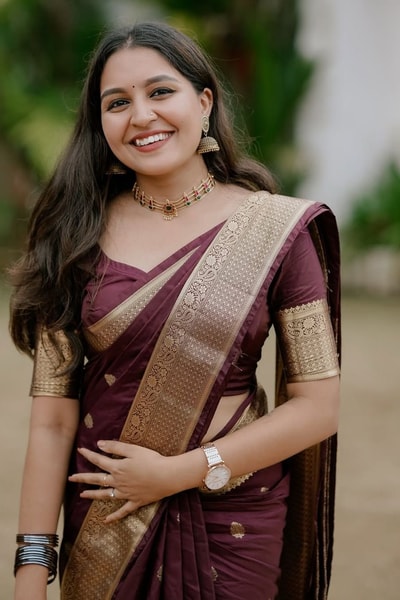 Lightweight Wine Banarasi Soft Silk Saree with Gold Zari Buttis and Broad Gold Border in Surat
