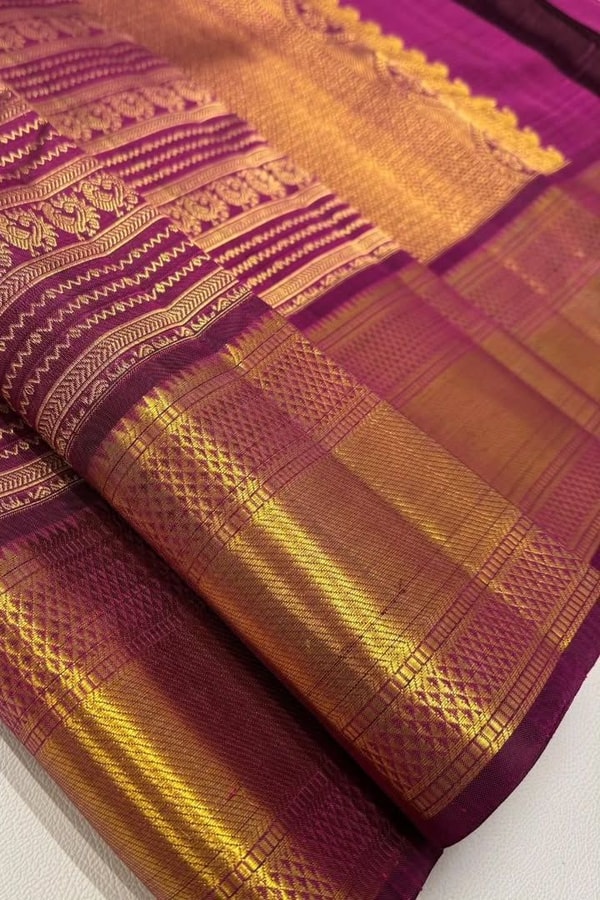 Magenta Banarasi Soft Silk Saree with Horizontal Gold Zari Motif Bands and Heavy Border  in Surat