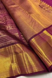 Magenta Banarasi Soft Silk Saree with Horizontal Gold Zari Motif Bands and Heavy Border  in Surat