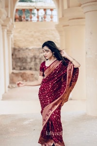 Maroon Banarasi Soft Silk Saree with Dense All-Over Gold Zari Motifs and Zari Border  in Surat