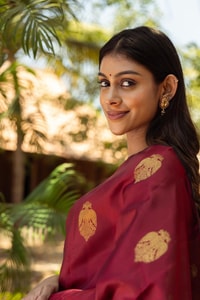 Maroon Banarasi Soft Silk Saree with Gold Zari Buttas and Black Contrast Border  in Surat