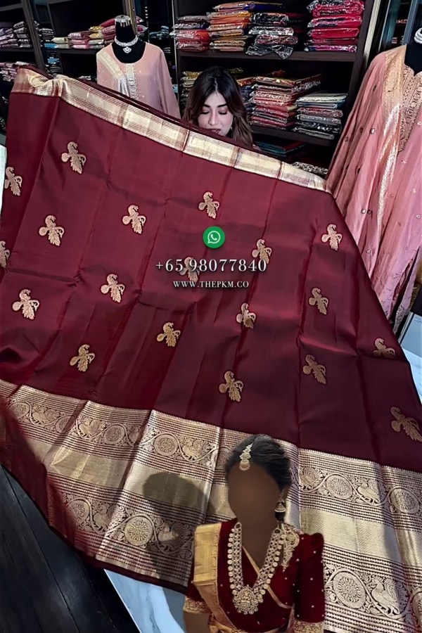 Maroon Banarasi Soft Silk Saree with Gold Zari Buttas and Wide Brocade Border  in Surat