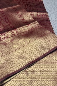 Maroon Banarasi Soft Silk Saree with Gold Zari Elephant and Folk Figure Brocade  in Surat