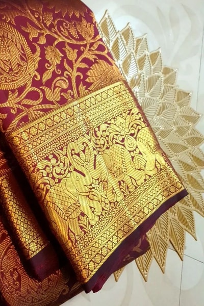 Maroon Bridal Banarasi Soft Silk Saree with All-Over Gold Zari Brocade and Heavy Border in Surat