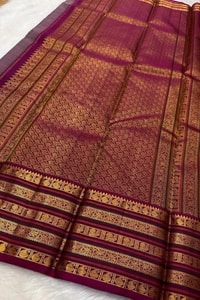 Maroon Bridal Banarasi Soft Silk Saree with All-Over Gold Zari Brocade and Heavy Border  in Surat