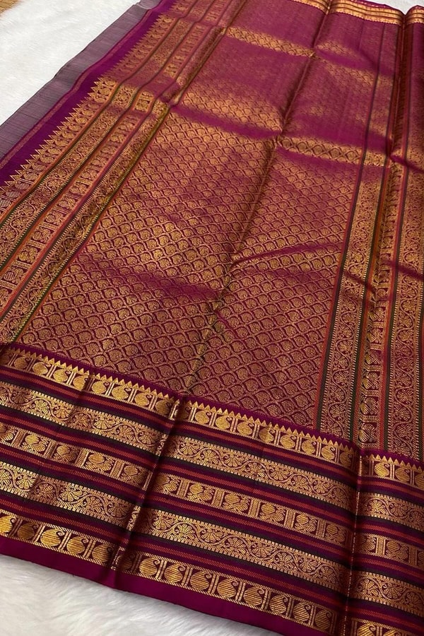 Maroon Bridal Banarasi Soft Silk Saree with All-Over Gold Zari Brocade and Heavy Border  in Surat