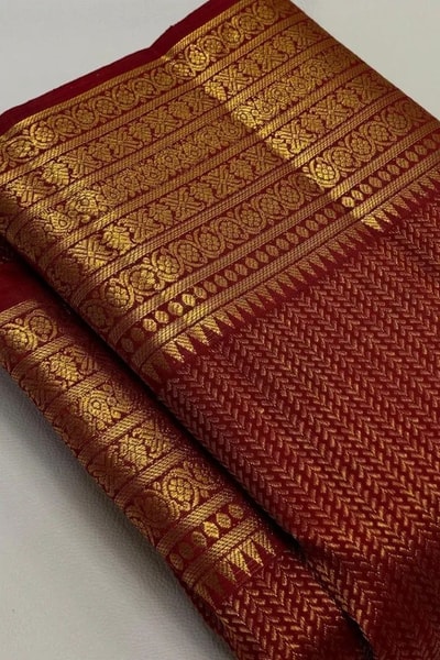 Maroon Red Banarasi Soft Silk Saree with Gold Zari Herringbone Weave and Multi-Band Border in Surat
