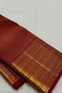 Maroon Red Banarasi Soft Silk Saree with Gold Zari Herringbone Weave and Multi-Band Border  in Surat