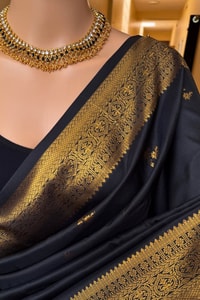 Minimal Gold Butti Banarasi Soft Silk Saree with Rich Zari Pallu in Black and Bottle Green  in Surat