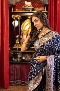 Navy Blue Banarasi Soft Silk Saree with Silver Zari Buttis and Large Paisley Motif Pallu  in Surat