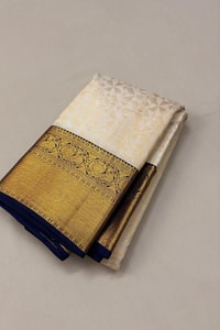 Off-White Banarasi Soft Silk Saree with Heavy Gold Zari Border and Navy Blue Edging  in Surat