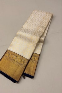 Off-White Banarasi Soft Silk Saree with Heavy Gold Zari Border and Navy Blue Edging  in Surat