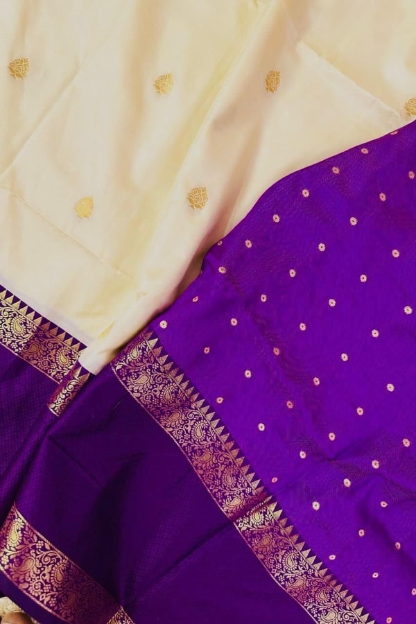 Off-White Banarasi Soft Silk Saree with Violet Zari Border and Gold Butti Body  in Surat