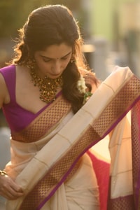 Off-White Kerala Style Banarasi Soft Silk Saree with Magenta Zari Border and Pinstripe Body  in Surat