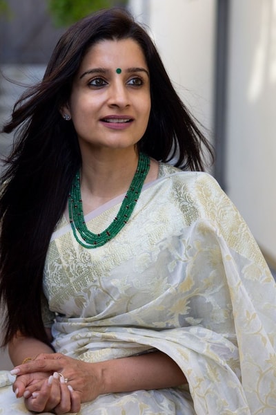 Off-White Saree with Pastel Green Woven Floral Motifs and Soft Silver Zari Accents in Surat