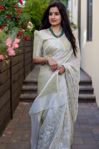 Off-White Saree with Pastel Green Woven Floral Motifs and Soft Silver Zari Accents  in Surat