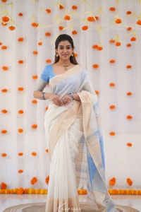 Off-White Saree with Silver Zari Contrast Border and Pallu in Green, Teal, Pink and Sky Blue  in Surat