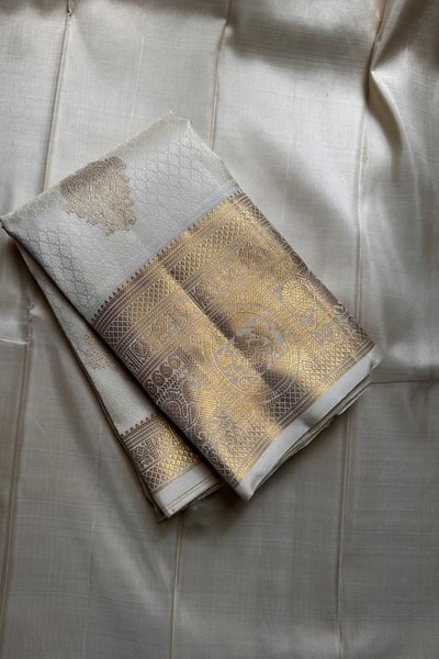 Off-White and Wine Banarasi Soft Silk Saree with Gold Zari Buttas and Wide Gold Border in Surat