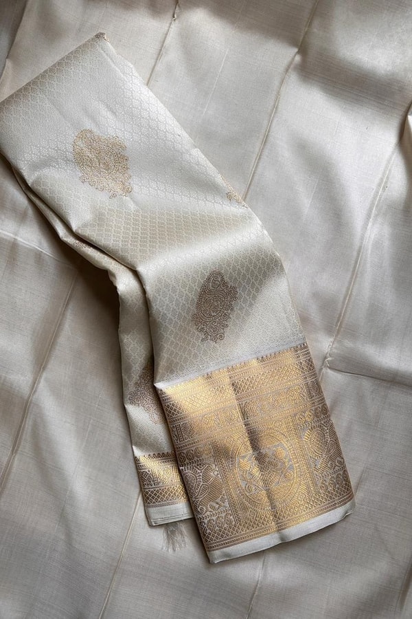 Off-White and Wine Banarasi Soft Silk Saree with Gold Zari Buttas and Wide Gold Border  in Surat