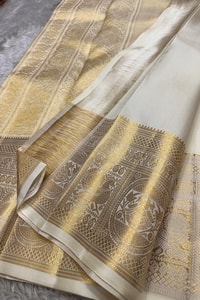 Off-White and Wine Banarasi Soft Silk Saree with Gold Zari Buttas and Wide Gold Border  in Surat