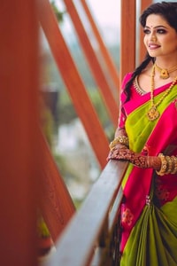 Parrot Green Soft Lichi Silk Saree with Rani Pink Border and Gold Zari Peacock Motifs  in Surat