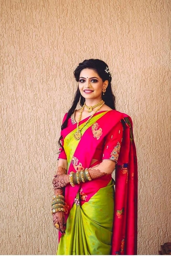 Parrot Green Soft Lichi Silk Saree with Rani Pink Border and Gold Zari Peacock Motifs  in Surat