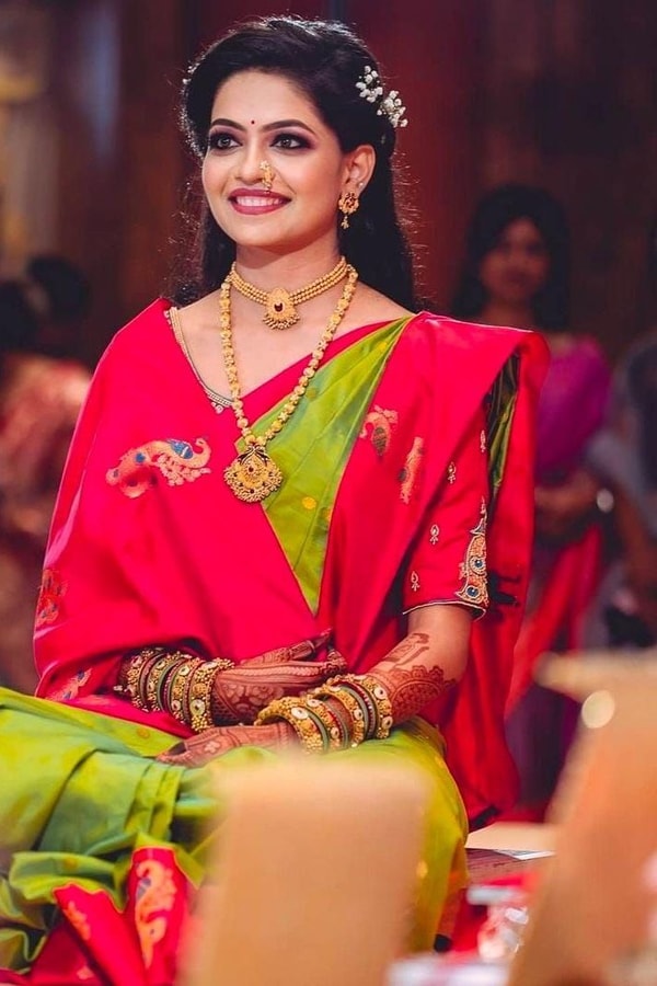 Parrot Green Soft Lichi Silk Saree with Rani Pink Border and Gold Zari Peacock Motifs  in Surat