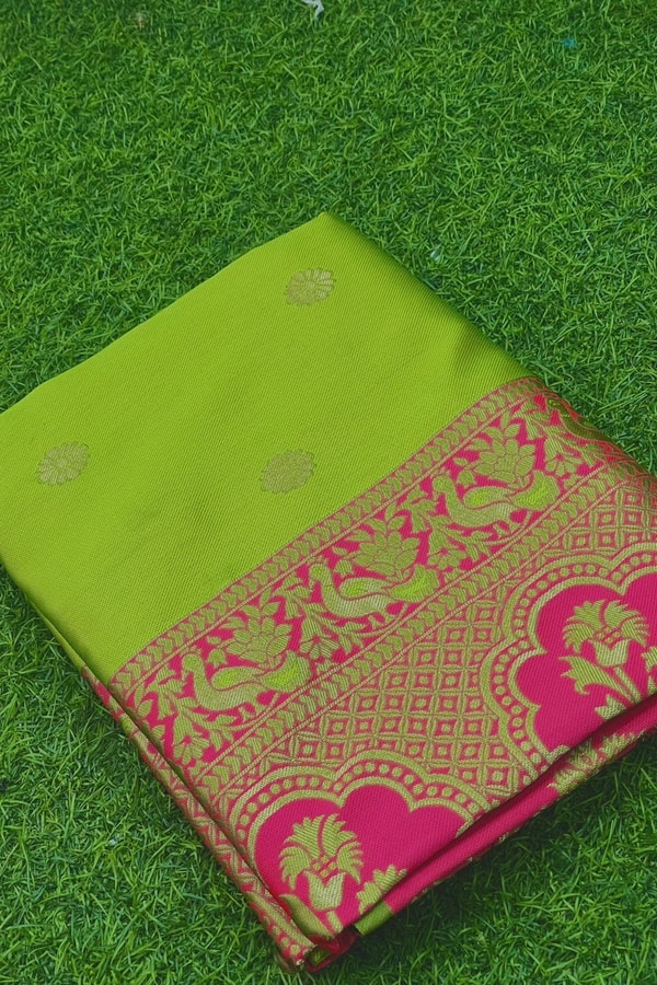 Parrot Green Soft Lichi Silk Saree with Rani Pink Border and Gold Zari Peacock Motifs  in Surat